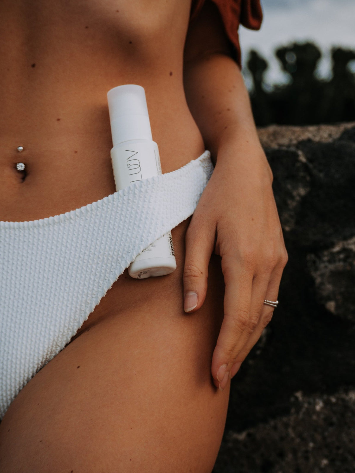 3. Close-up of LUUV Natural Self Tanning Foam Dark in white bikini, lifestyle setting