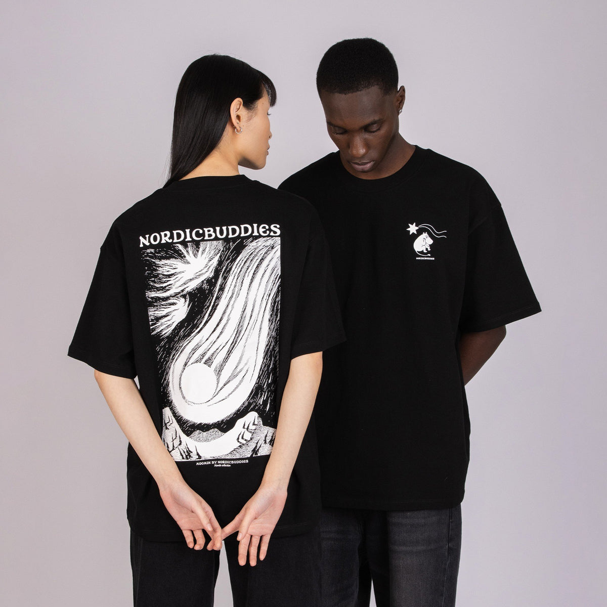 1. Unisex black Moomin t-shirt worn by male and female models, showcasing front and back designs in studio setting