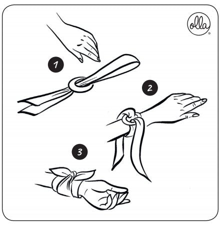 5. Instruction diagram for styling Olla Silk Ribbon Bracelet, showing steps to tie the ribbon