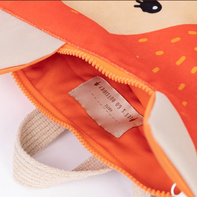 9. Close-up of Muni fox backpack interior, showing zipper closure and slip pockets