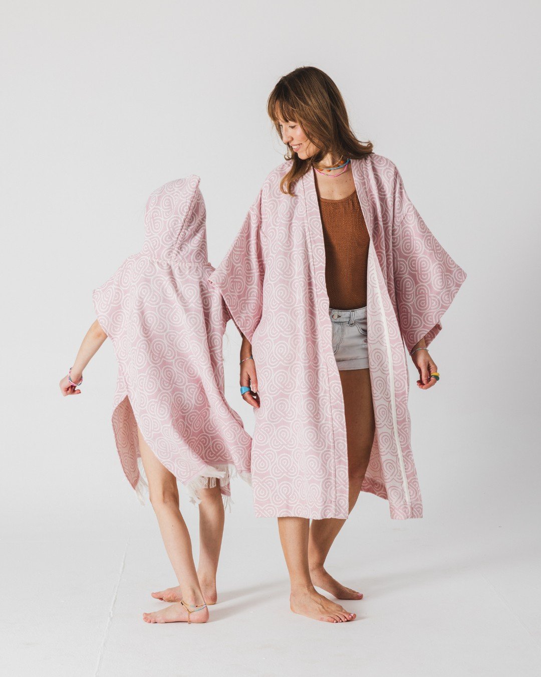 3. Woman and girl standing back to back in Patulove rose bamboo kimonos, girl wearing hooded version