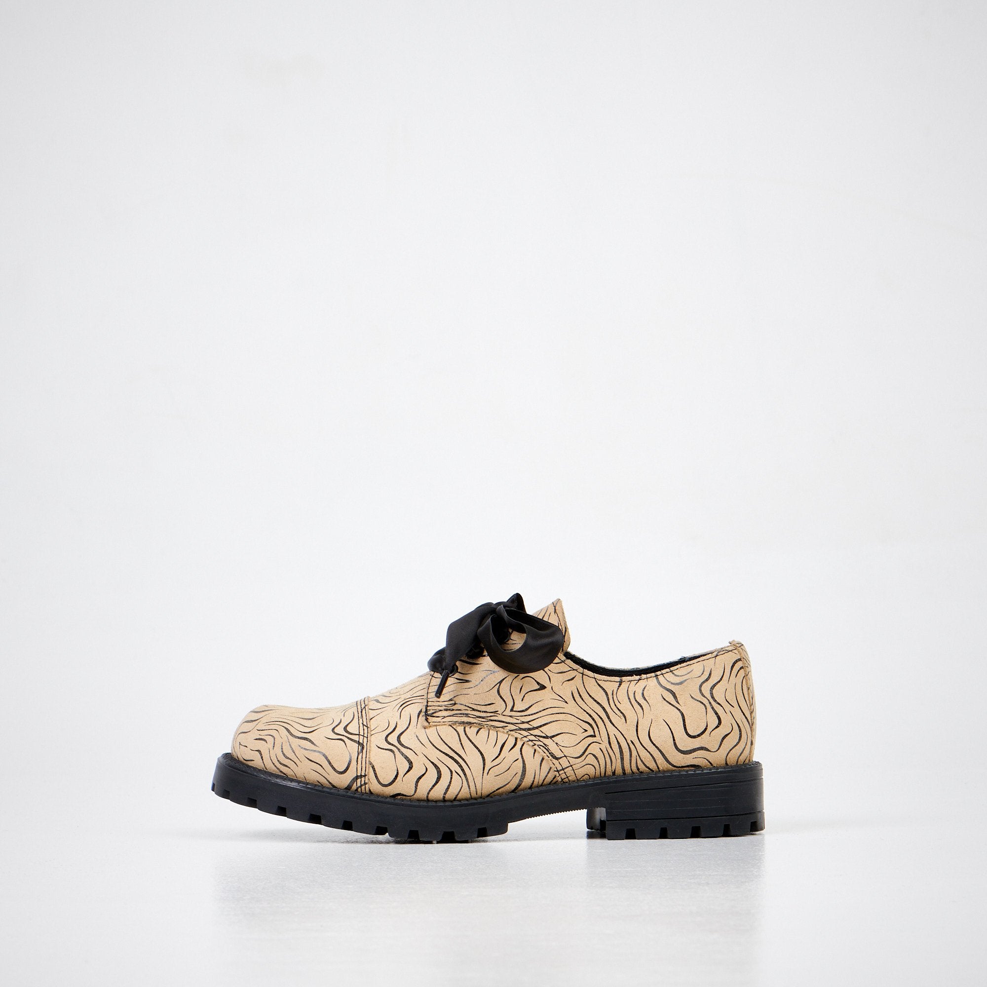 1. Unisex Samelin Beige Zebra Widgets in genuine leather, side view in studio setting