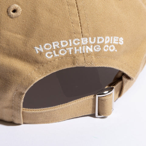 5. Close-up of NordicBuddies Clothing Co. embroidery and adjustable strap on sand dad cap