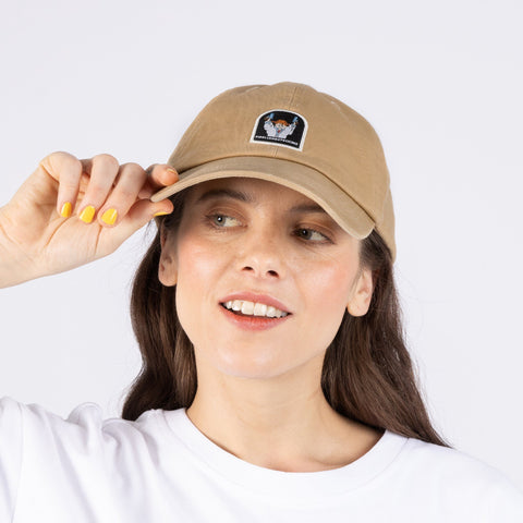 1. Woman wearing Pippi And The Bang Dad Cap in sand color by Moomin, shown in studio setting