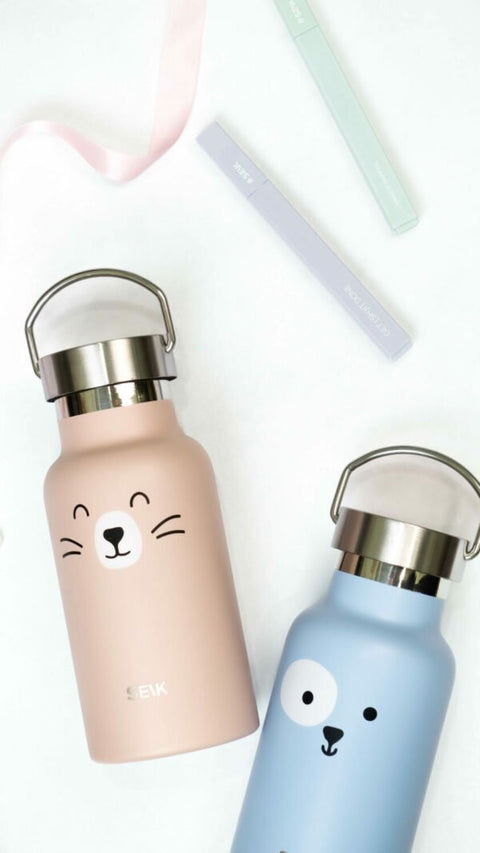 3. SEIK pink and blue stainless steel water bottles with cat and bear designs, shown in lifestyle setting