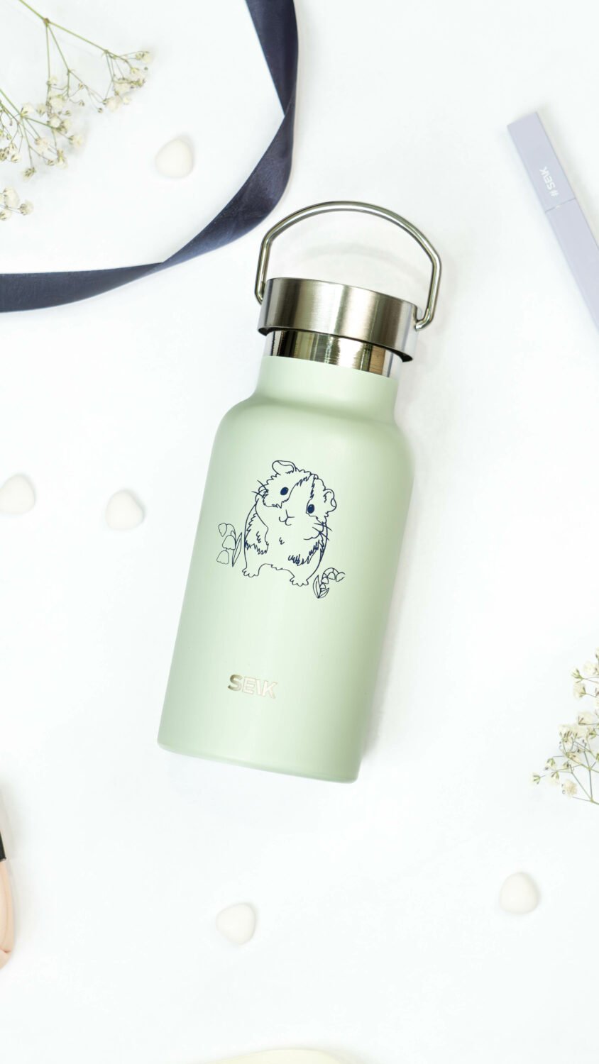4. Close-up of SEIK light green water bottle with guinea pig design and stainless steel cap