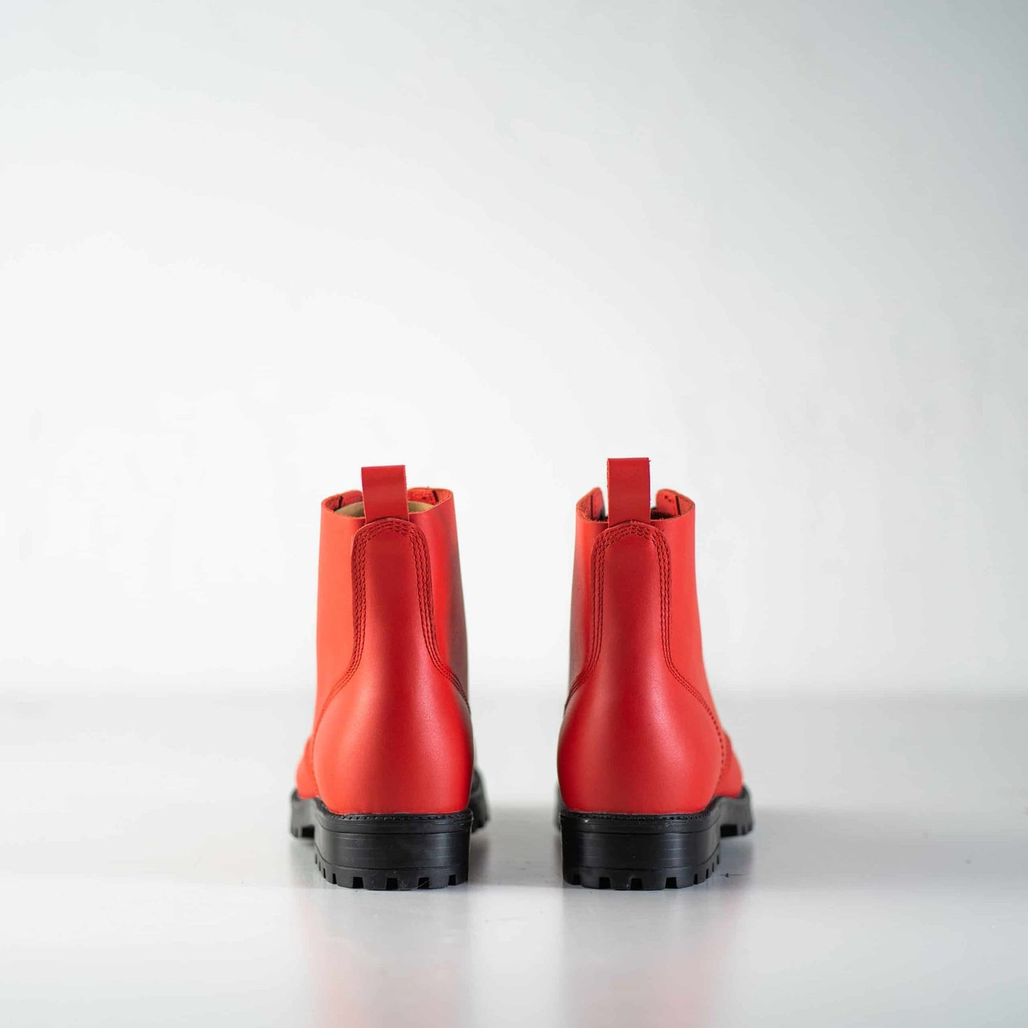 3. Back view of unisex red Aviator Boots by Samelin, showing sturdy construction and pull tabs