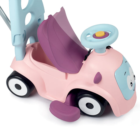 5. Close-up of Smoby Ride-on Maestro 3in1 in pink showing open storage compartment under seat