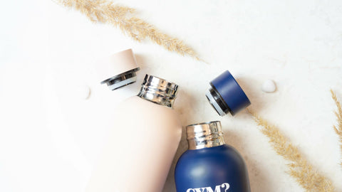 4. Close-up of SEIK water bottles in beige and navy, showing vacuum-insulated caps and stainless steel interiors