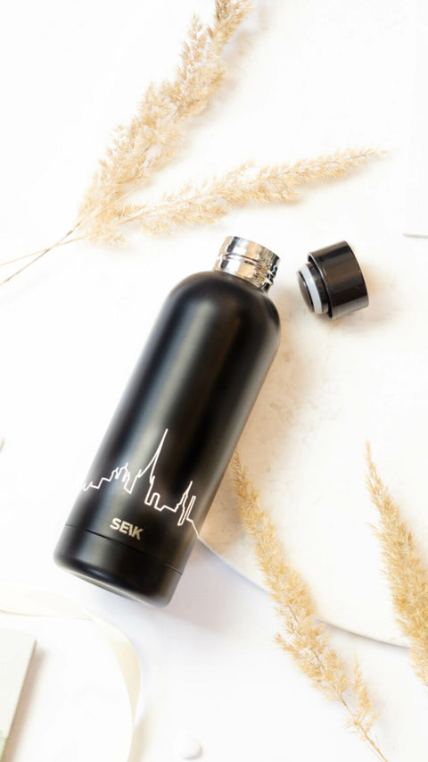 1. SEIK black stainless steel water bottle with Tallinn skyline design, shown with open cap on a light background