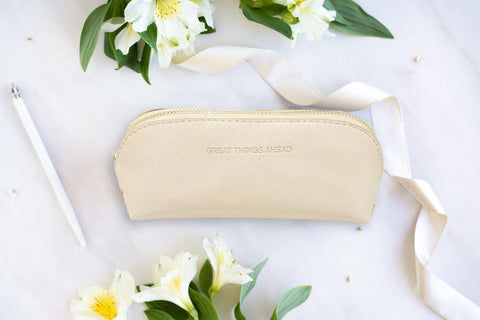 1. SEIK beige pencil case with 'Great Things Ahead' text, styled with flowers and ribbon