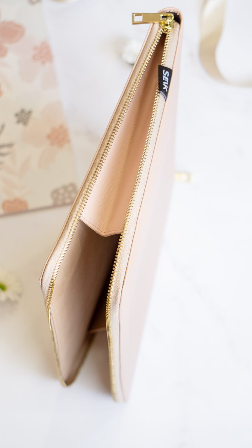 8. SEIK pink laptop sleeve with open zipper, showing interior space