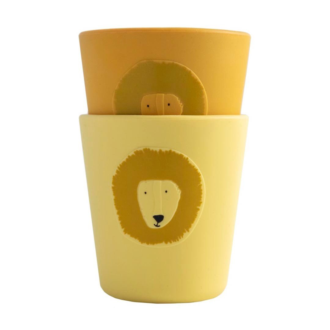 2. Stackable yellow and orange silicone cups with lion face design by Trixie Baby