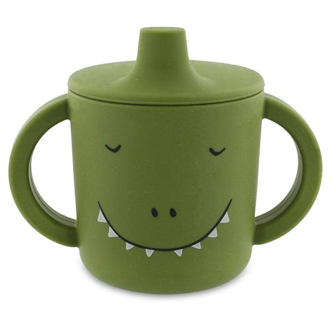 2. Green silicone sippy cup with dinosaur face design and big handles, shown from front on white background