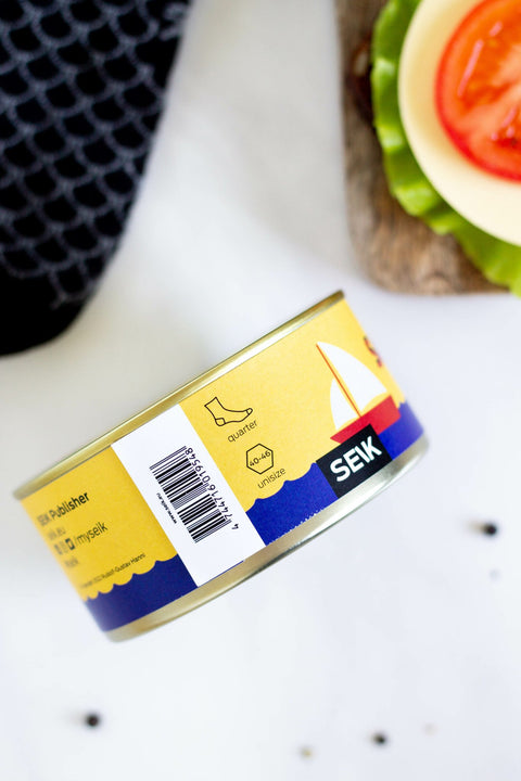 1. SEIK Sardines socks packaging with quirky sardine-inspired design, shown with barcode and product details