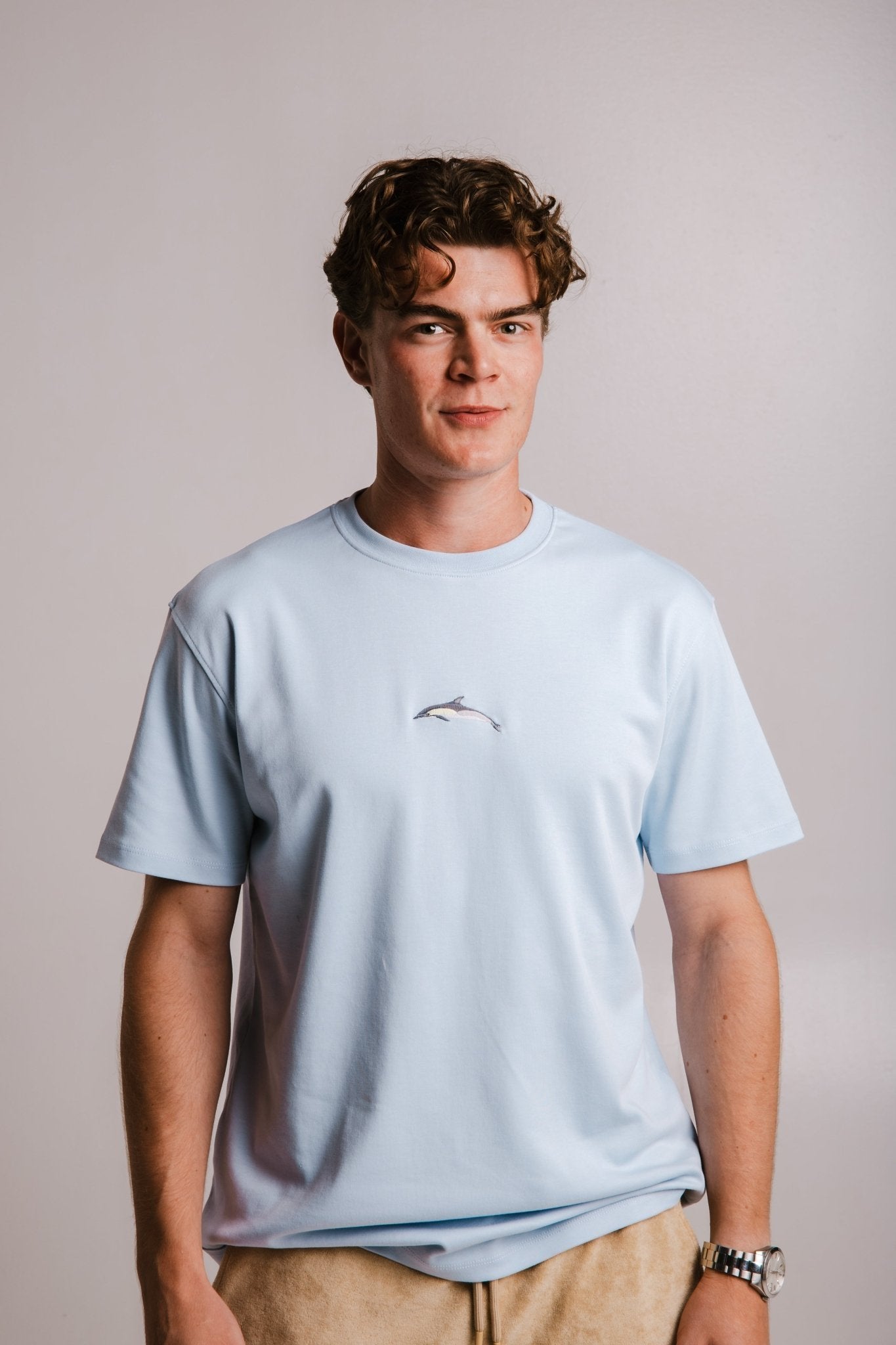 1. Men's light blue Dolphin Heavy T-shirt by Sossu, featuring embroidered design, shown in studio setting