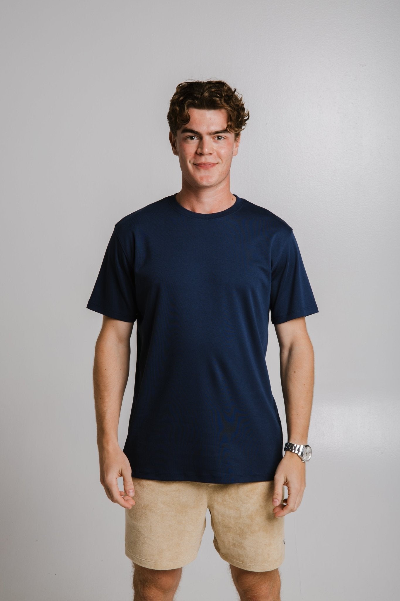 1. Unisex navy blue heavy T-shirt by Sossu worn by male model in studio, front view