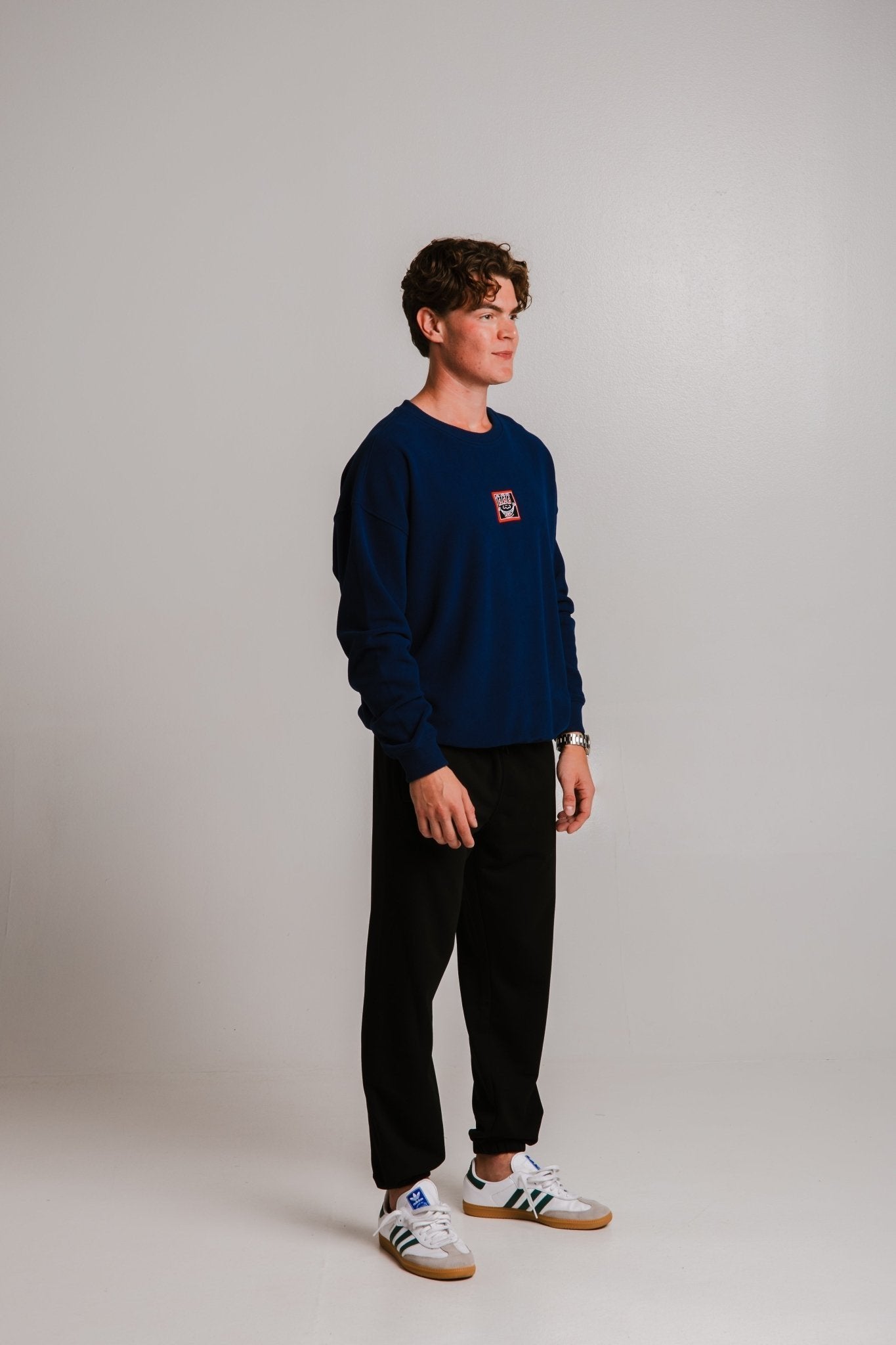 1. Unisex black Panda Soft Fleece Sweatpants by Sossu worn by male model in studio setting