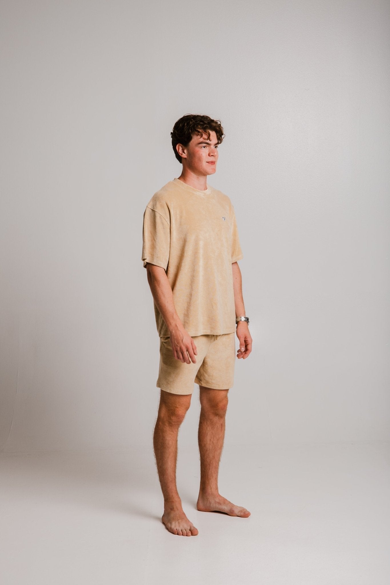 1. Unisex light brown Panda Terry T-shirt by Sossu worn by male model in studio, showcasing relaxed fit