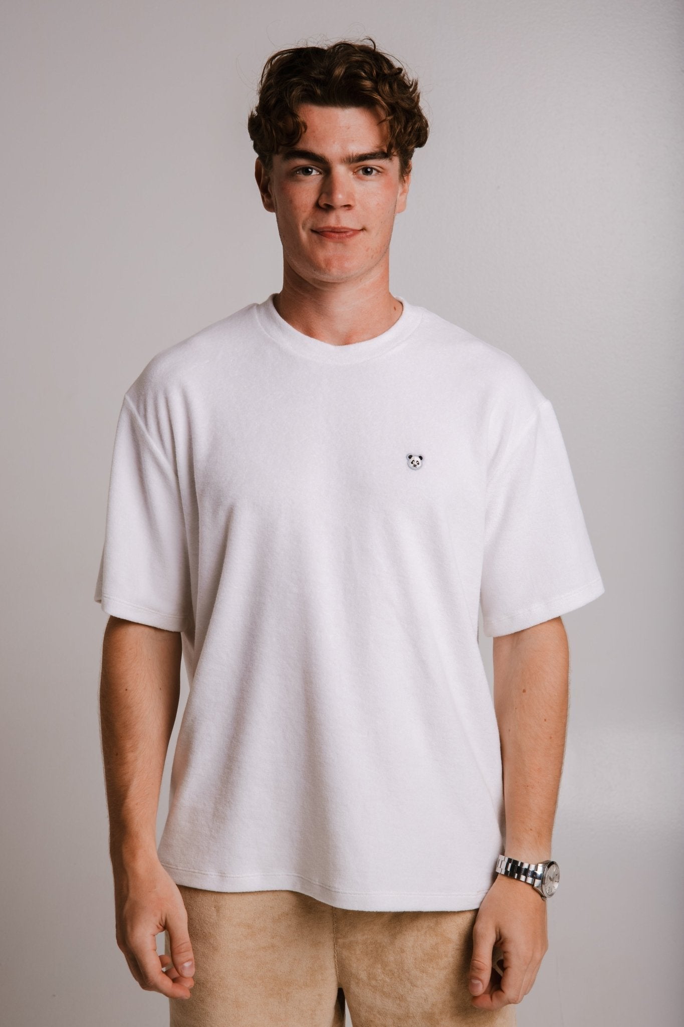 1. Unisex white Panda Terry T-shirt by Sossu worn by male model, front view