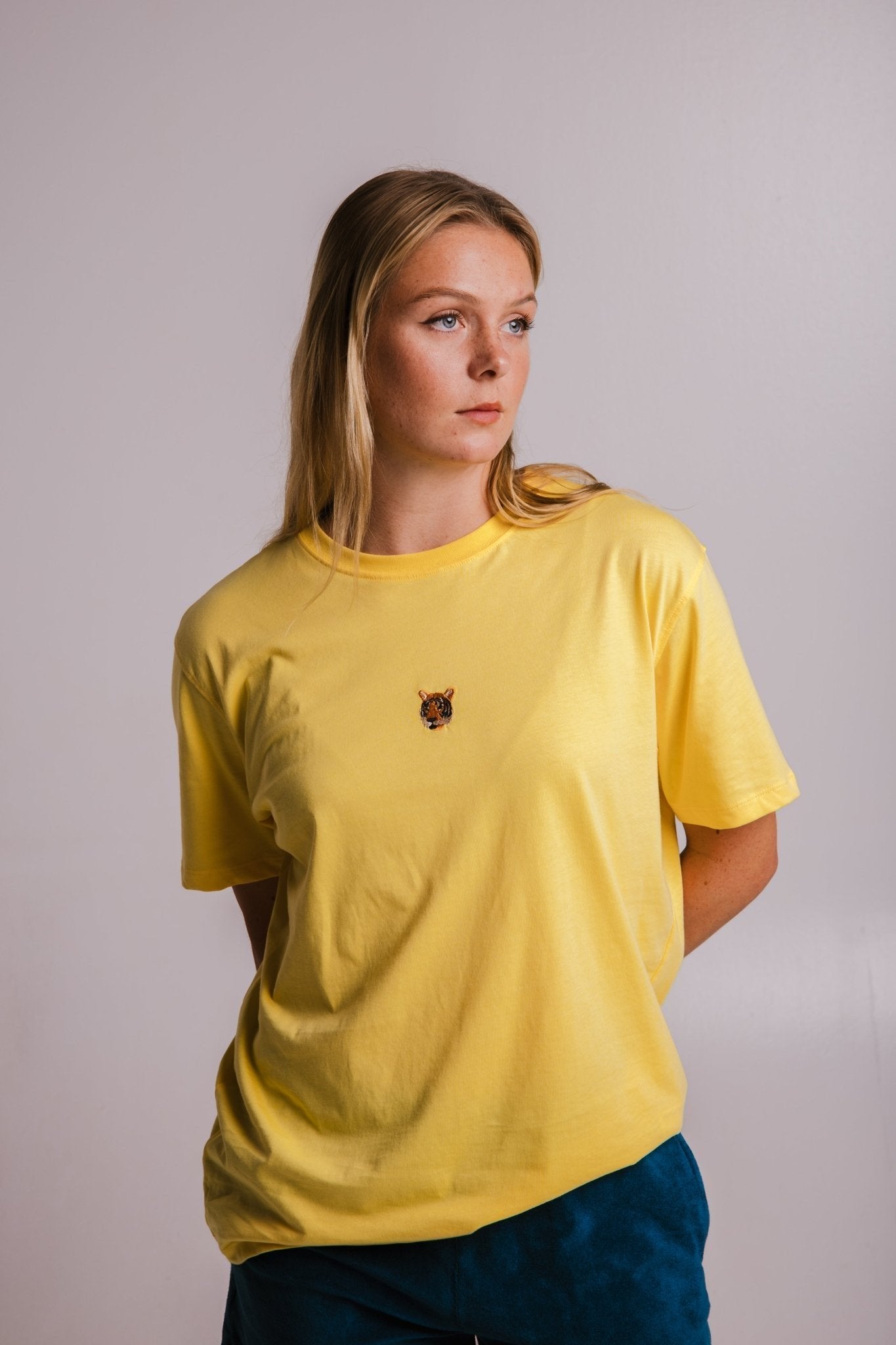 1. Women's yellow Tiger T-shirt by Sossu, shown in studio setting