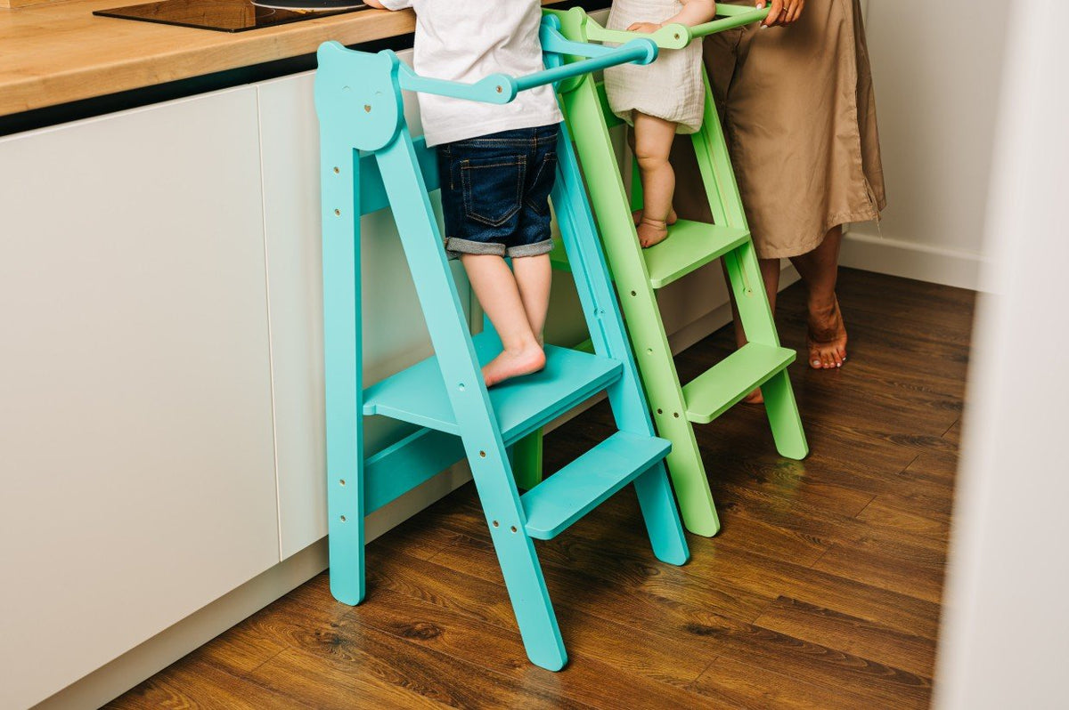 10. Blue and green step stools side by side in kitchen