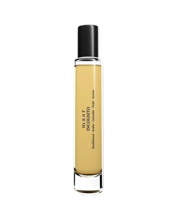 2. Maar Incognito spray perfume bottle with black cap and amber liquid on white background