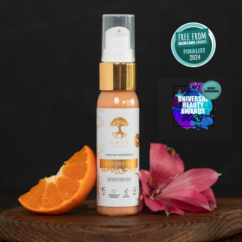 1. HOIA homespa Restoring Hand Cream SUPERSTAR, 30ml bottle with awards, orange slice, and pink flower, showcasing premium skincare