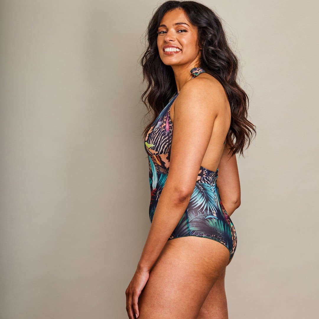 2. Side view of women's Tan Through Halterneck Swimsuit by SWIMSARA, highlighting tropical print and fit