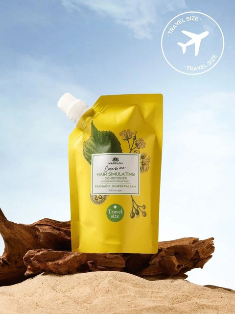 1. Travel size Magrada Organic Cosmetics linden flower conditioner with Nordic birch extract on sandy beach setting
