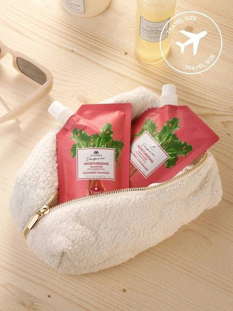 2. Magrada Organic Cosmetics travel size rhubarb hair mask in a cosmetic bag, ideal for travel and daily use