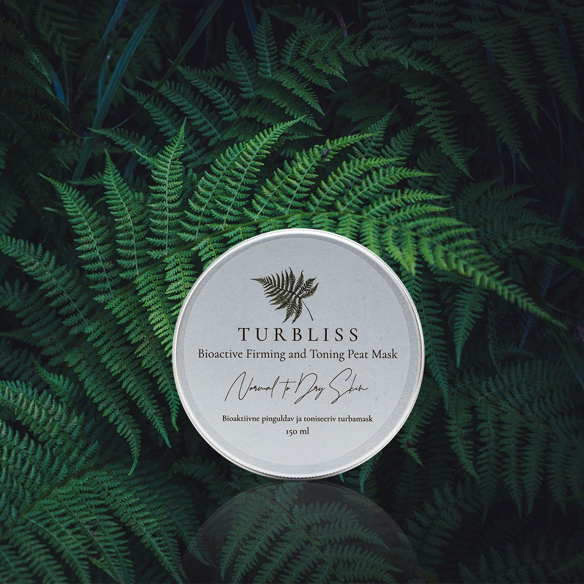 2. Turbliss Bioactive Firming and Toning Peat Mask 150ml displayed on lush green ferns