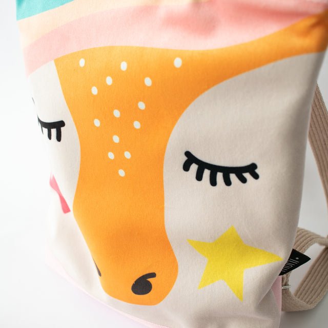 12. Close-up of MUNI Unicorn backpack design, showing unicorn face and colorful details