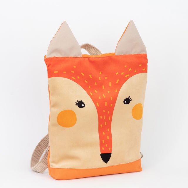 8. Studio image of Muni kids fox backpack, side view showing beige shoulder straps