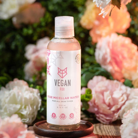 5. Vegan Fox Rose Micellar Water bottle in a floral setting, highlighting eco-friendly packaging