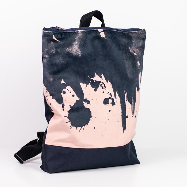 4. Side view of Muni Watercolor backpack in pink with adjustable straps