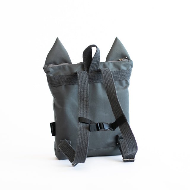 10. Back view of Muni kids wolf backpack in studio, showing adjustable straps
