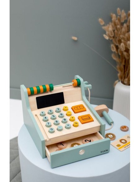 4. Wooden cash register with open drawer and accessories on a round table