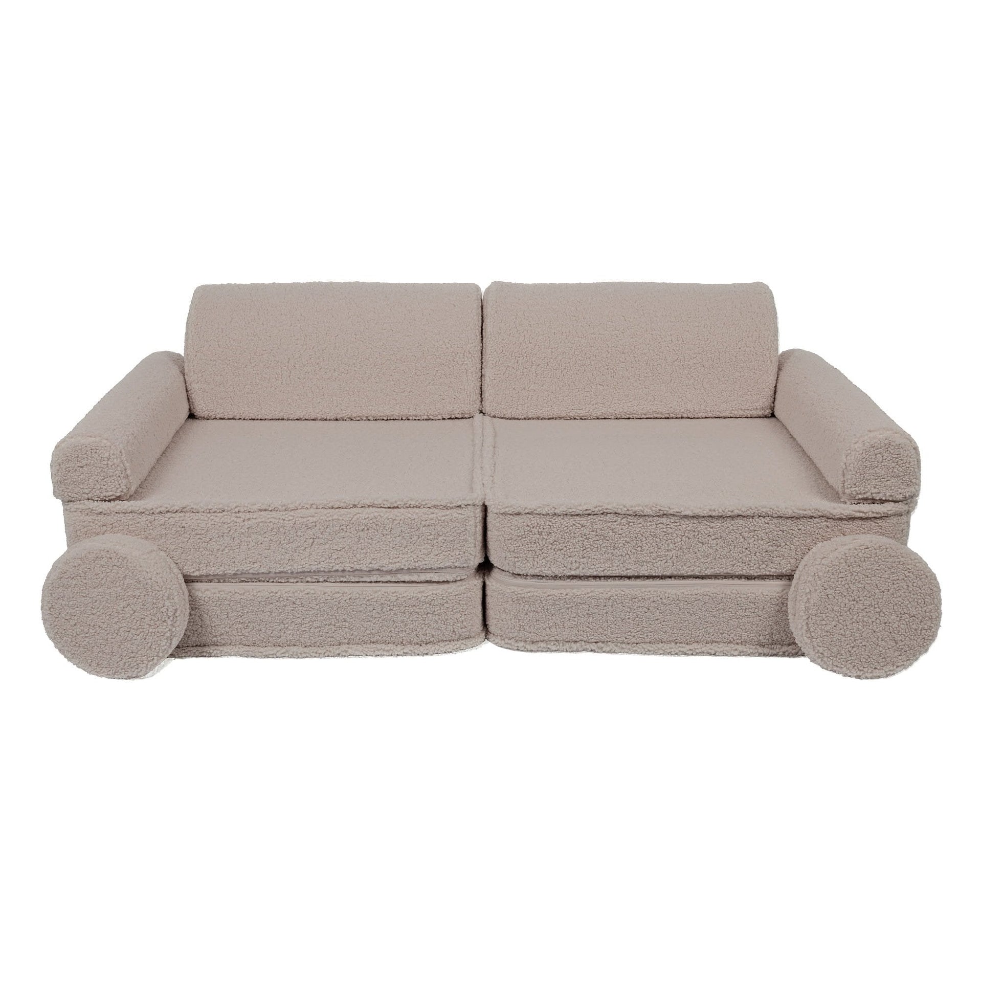 1. Large modular children's sofa in light grey with rounded armrests and circular cushions, shown in a studio setting