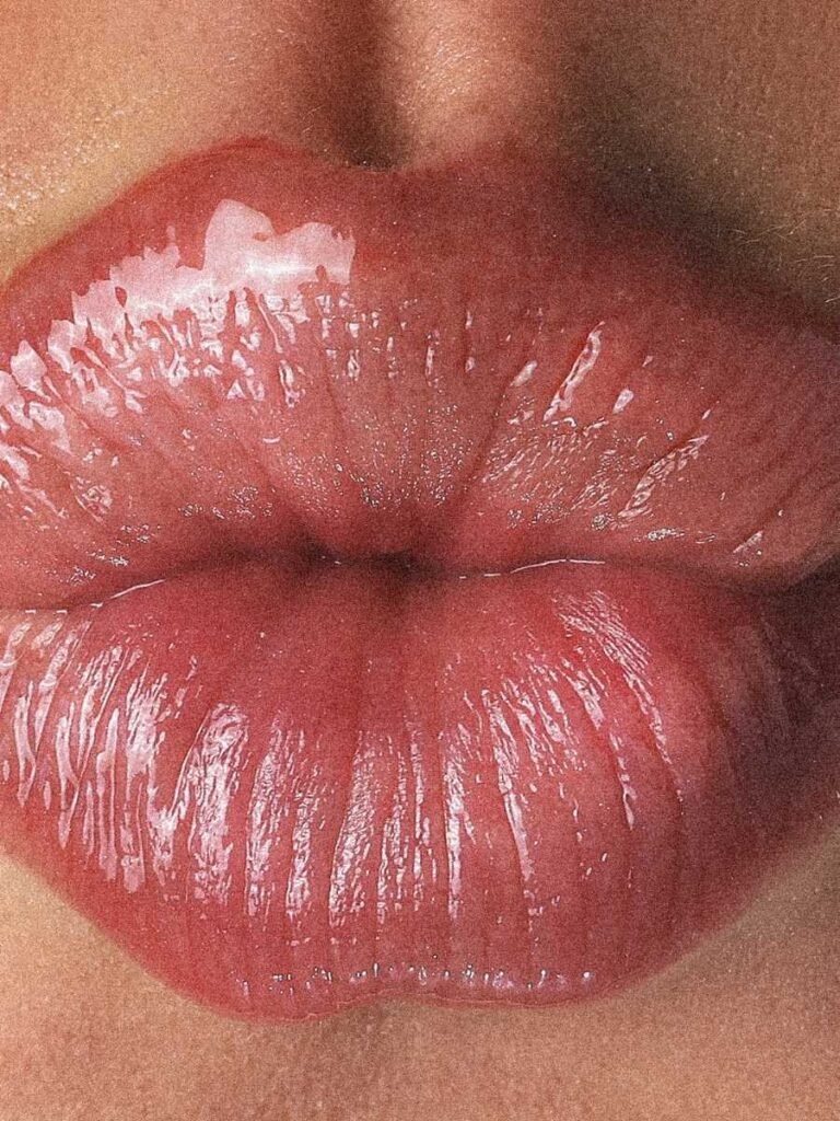 1. Close-up of glossy lips with Magrada Organic Cosmetics Blueberry Tinted Lip Balm, showcasing natural shine and berry tint