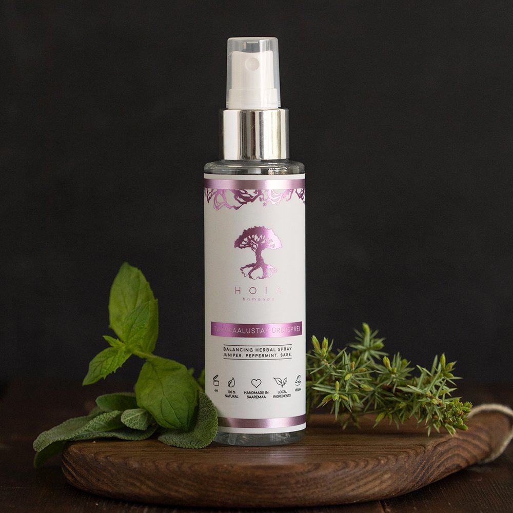 1. HOIA homespa Balancing Herbal Spray with juniper, peppermint, and sage, shown with natural decor