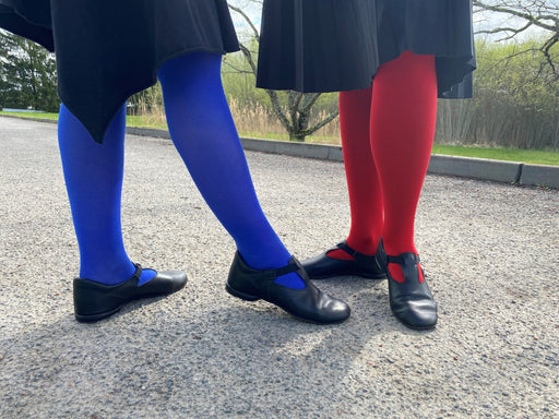 1. Women's black Kergatsi dance shoes by OmaKing worn with colorful tights, shown outdoors
