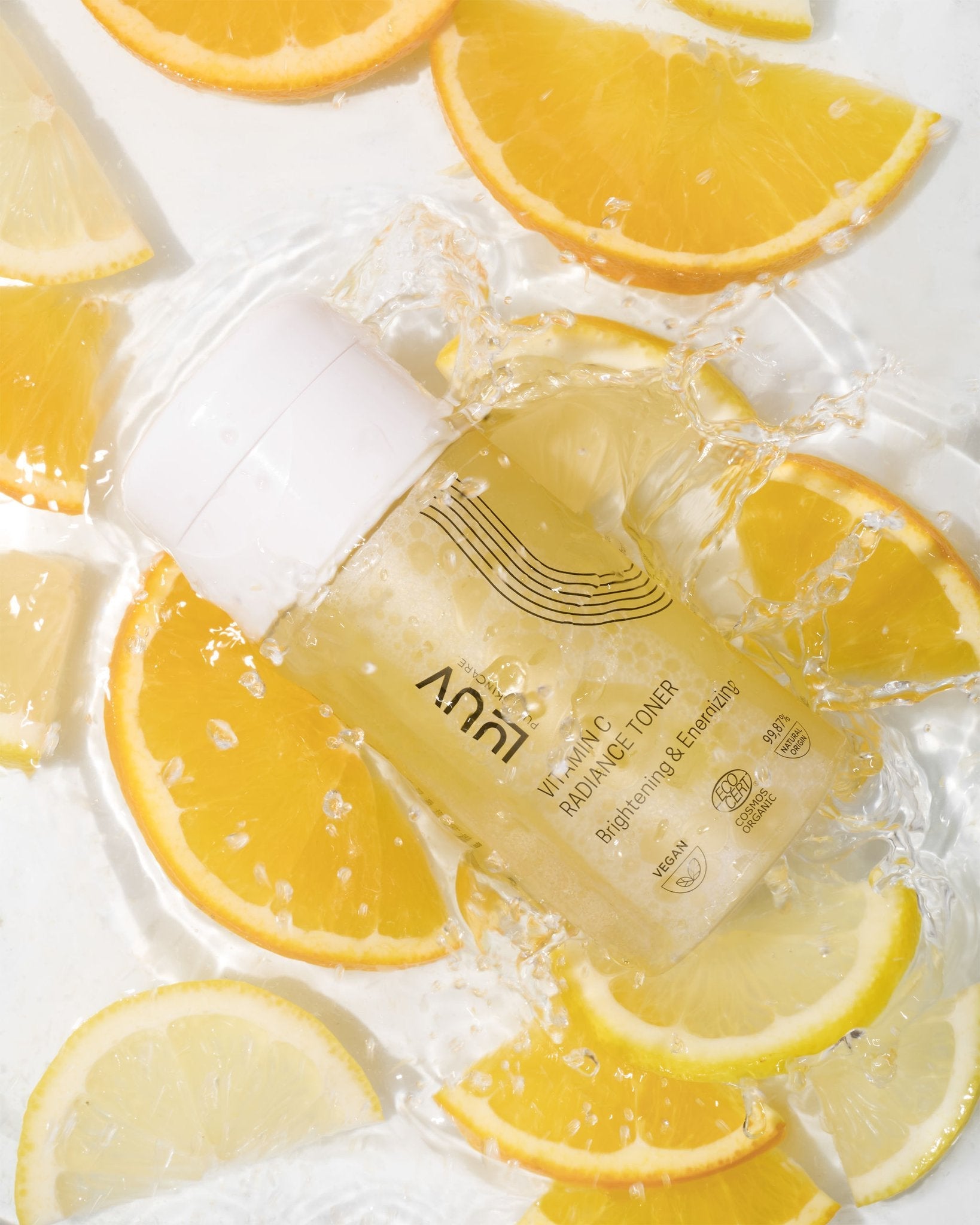1. LUUV Vitamin C Radiance Toner bottle surrounded by fresh orange slices, highlighting its brightening and hydrating properties