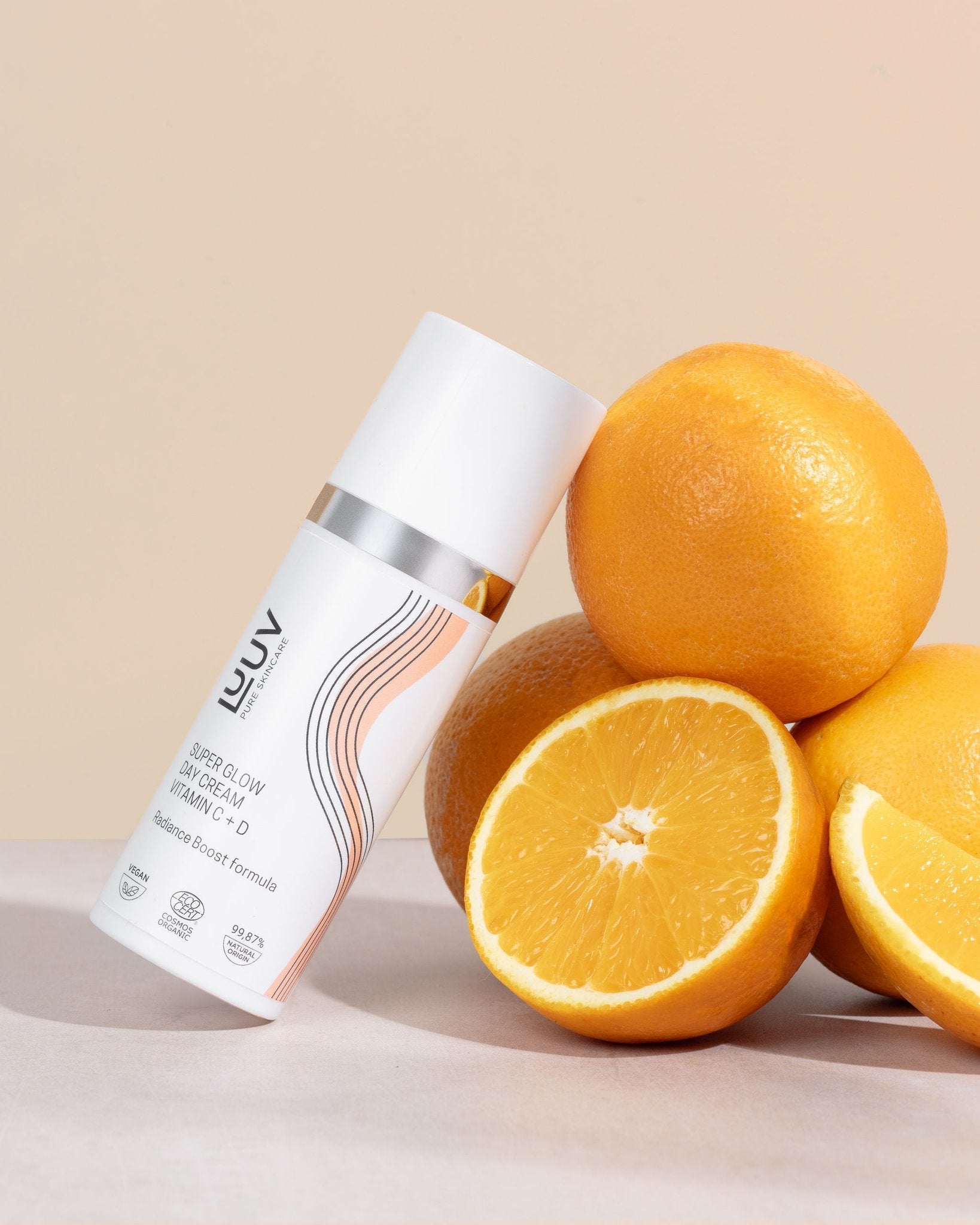 1. LUUV Super Glow Day Cream with Vitamin C + D, 50ml, shown with fresh oranges for a natural radiance boost