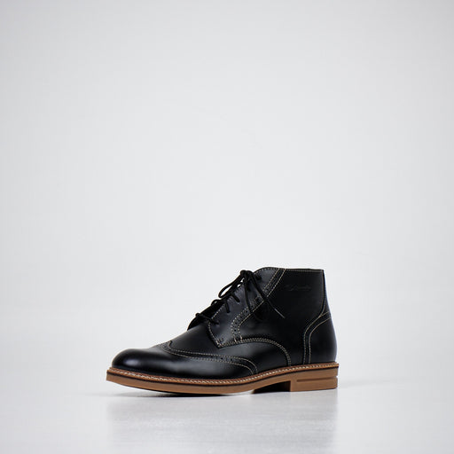 1. Studio shot of Samelin Black Ankle Boots 424 showcasing dyed natural leather upper and non-slip rubber sole