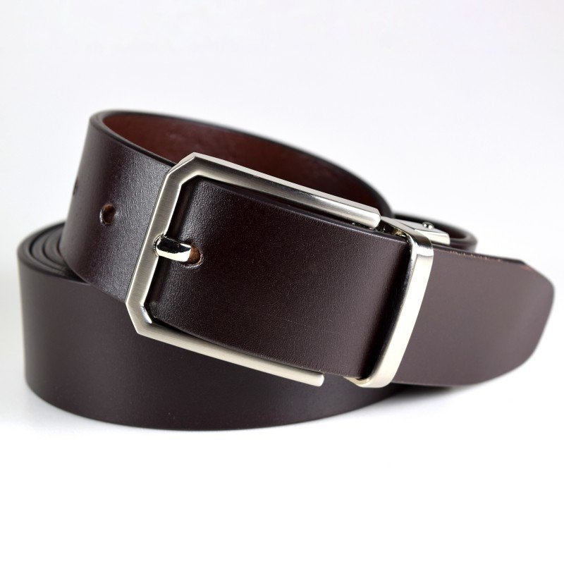 1. Women's black leather belt with metal O ring by PYKOK, styled over a navy outfit
