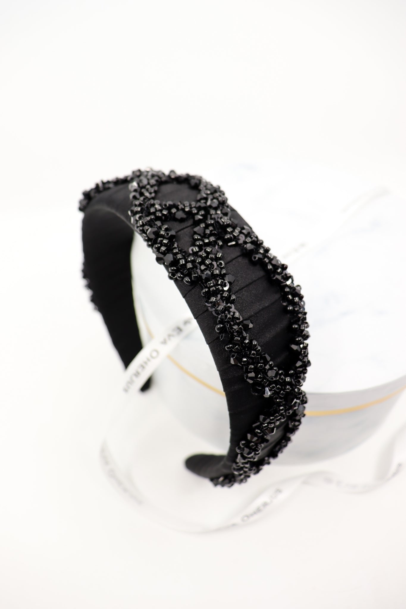 1. Woman wearing RÄTT cotton terry headband during spa treatment, showcasing adjustable fit