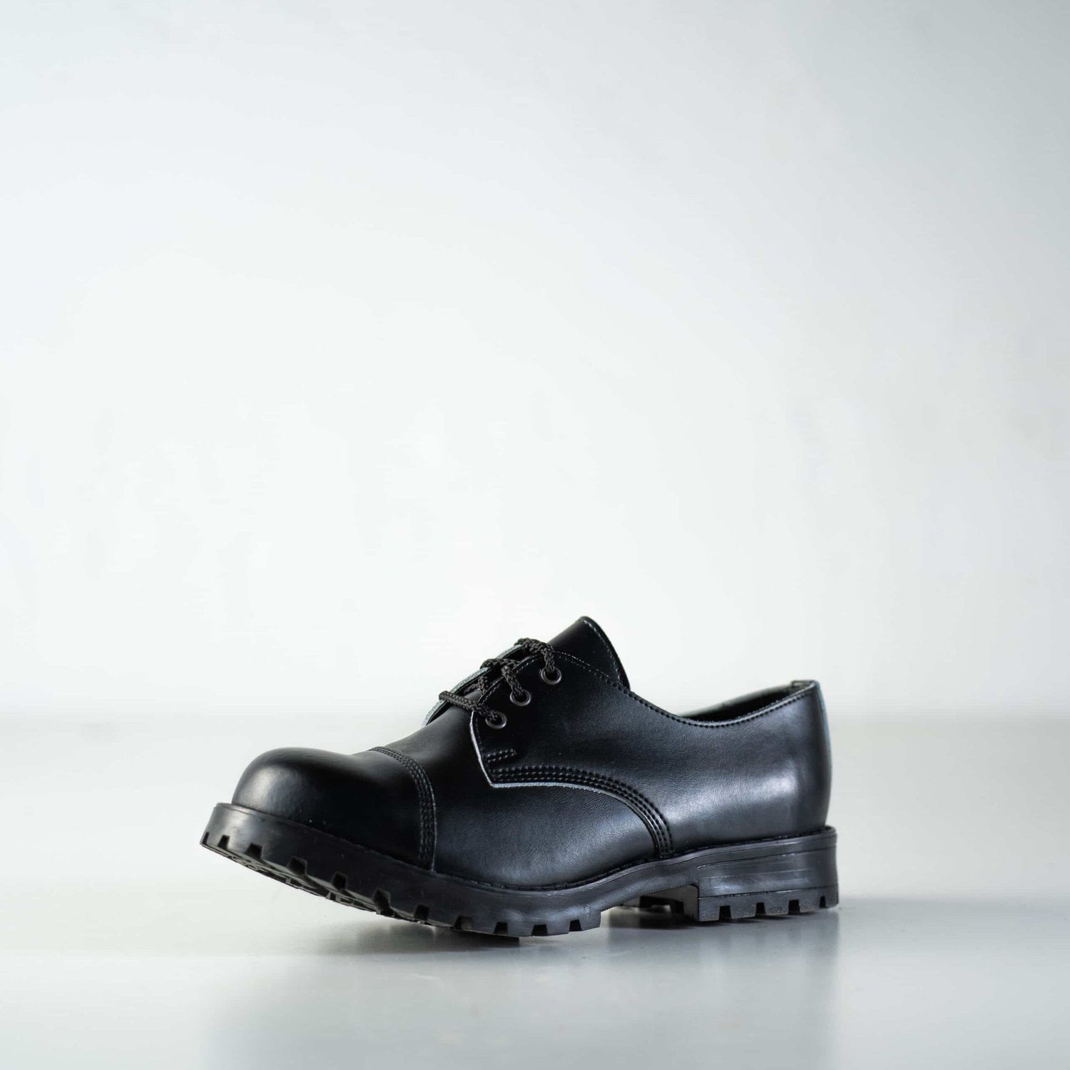 1. Unisex black Samelin Widgets worn by male model in studio setting