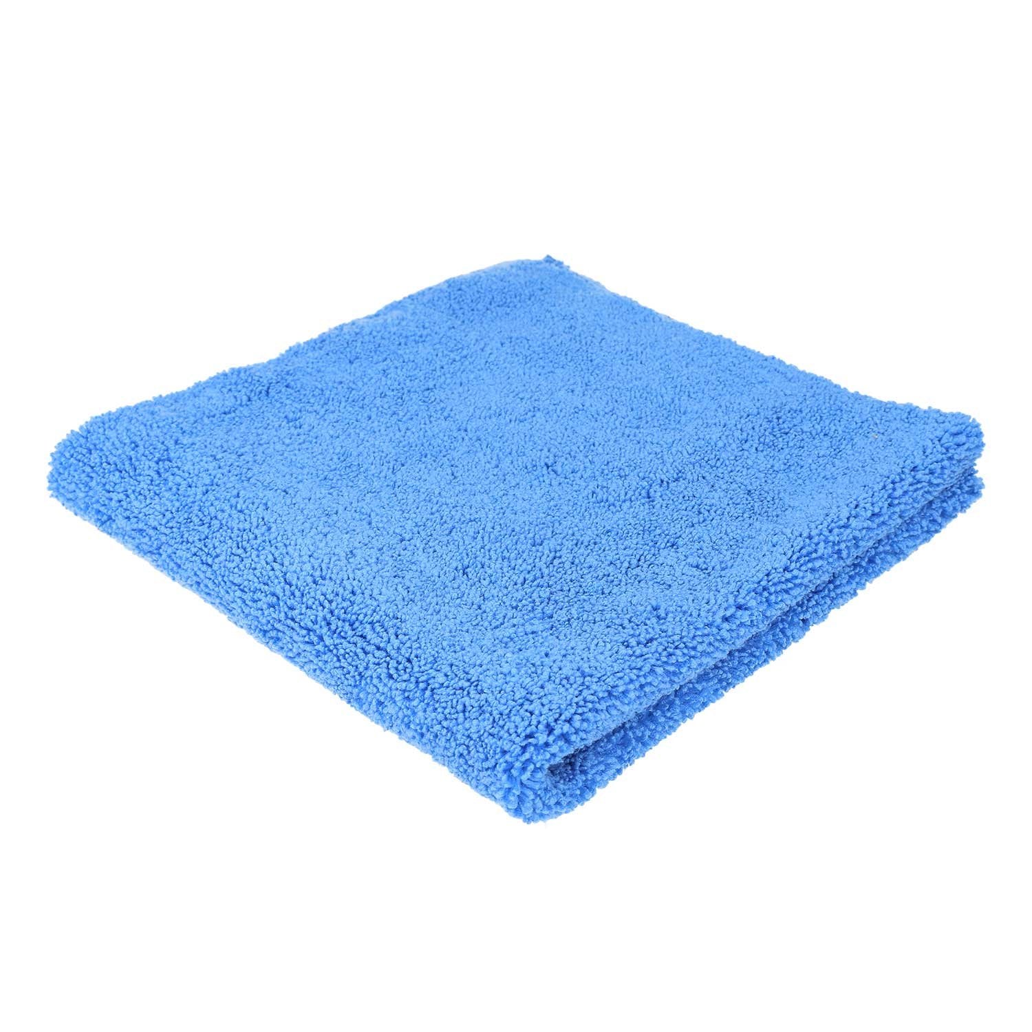 1. Men's dark grey bamboo terry spa wrap by RÄTT, worn by male and female models outdoors near a hot tub