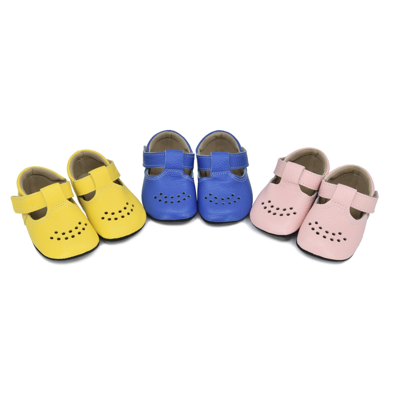 1. Child wearing Omaking dark grey felt slippers in a cozy home library setting
